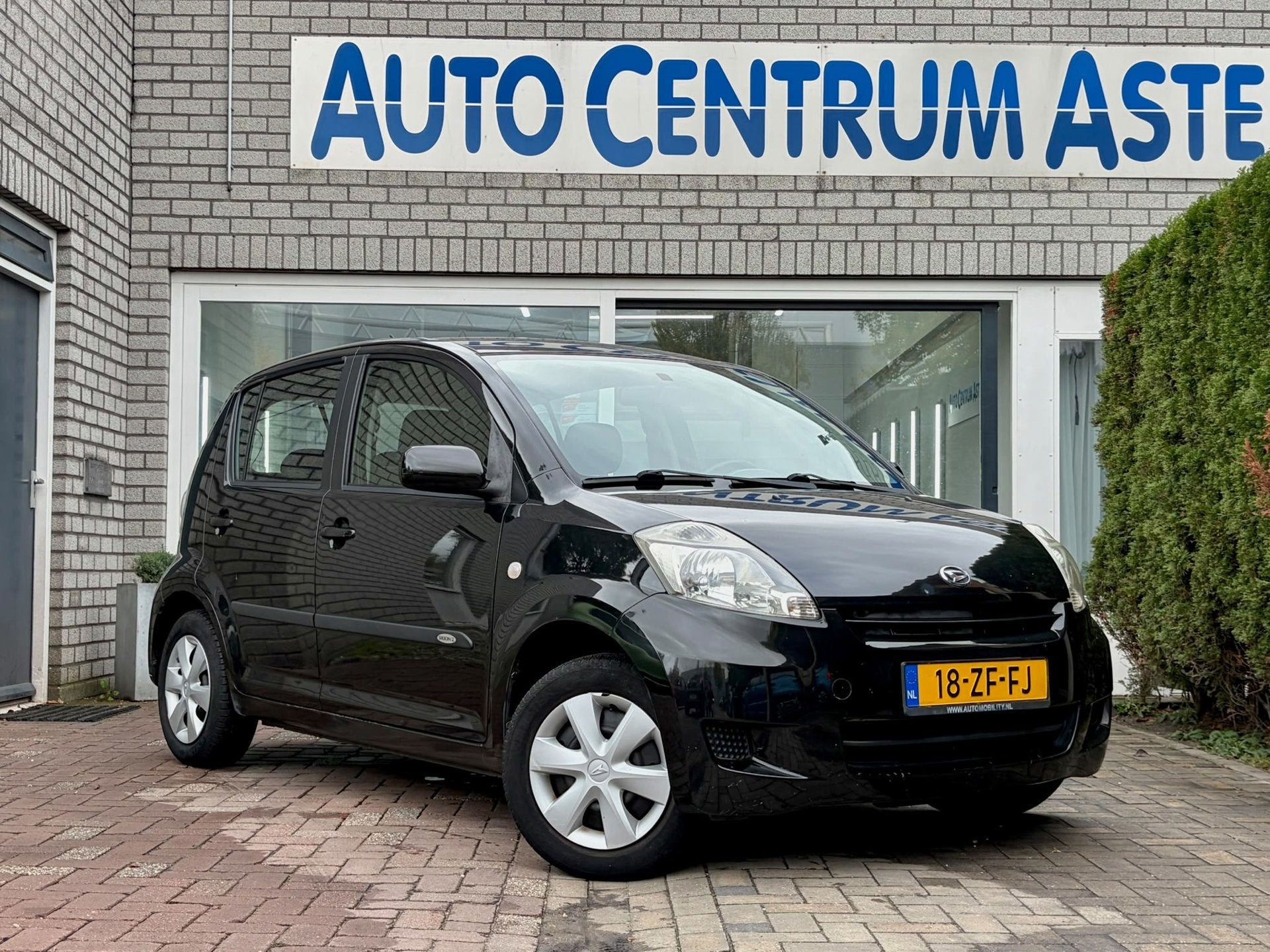 Daihatsu Sirion 2 1.0-12V Premium, Auto's, Voorwielaandrijving, Gebruikt, Zwart, Handgeschakeld