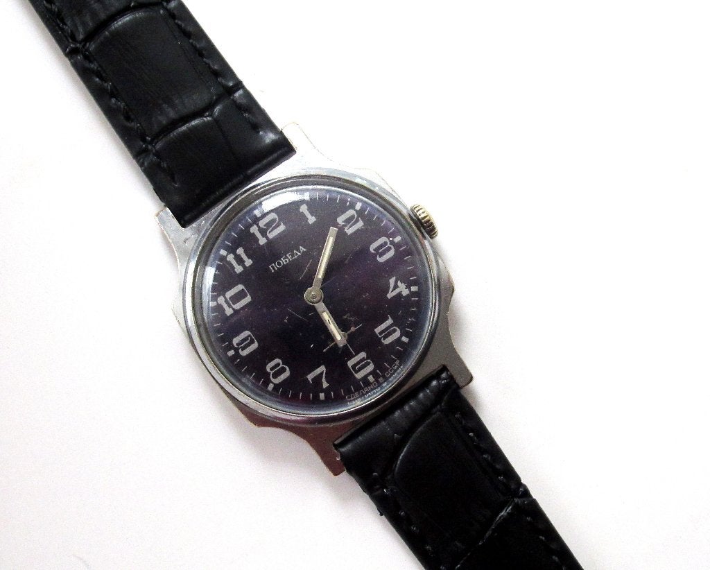 Pobeda vintage mechanisch heren horloge van de jaren 80., Ophalen of Verzenden, Gebruikt, Leer, Overige merken