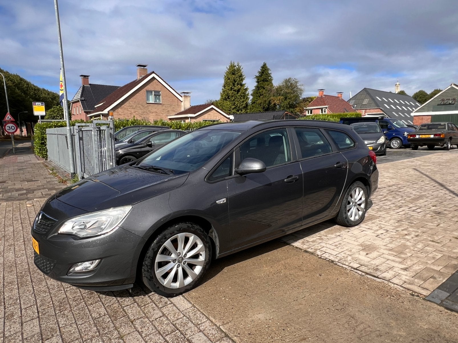 Opel Astra 1.4 Turbo 88KW Sports Tourer 2012 Grijs, Auto's, Voorwielaandrijving, 4 cilinders, Origineel Nederlands, Handgeschakeld