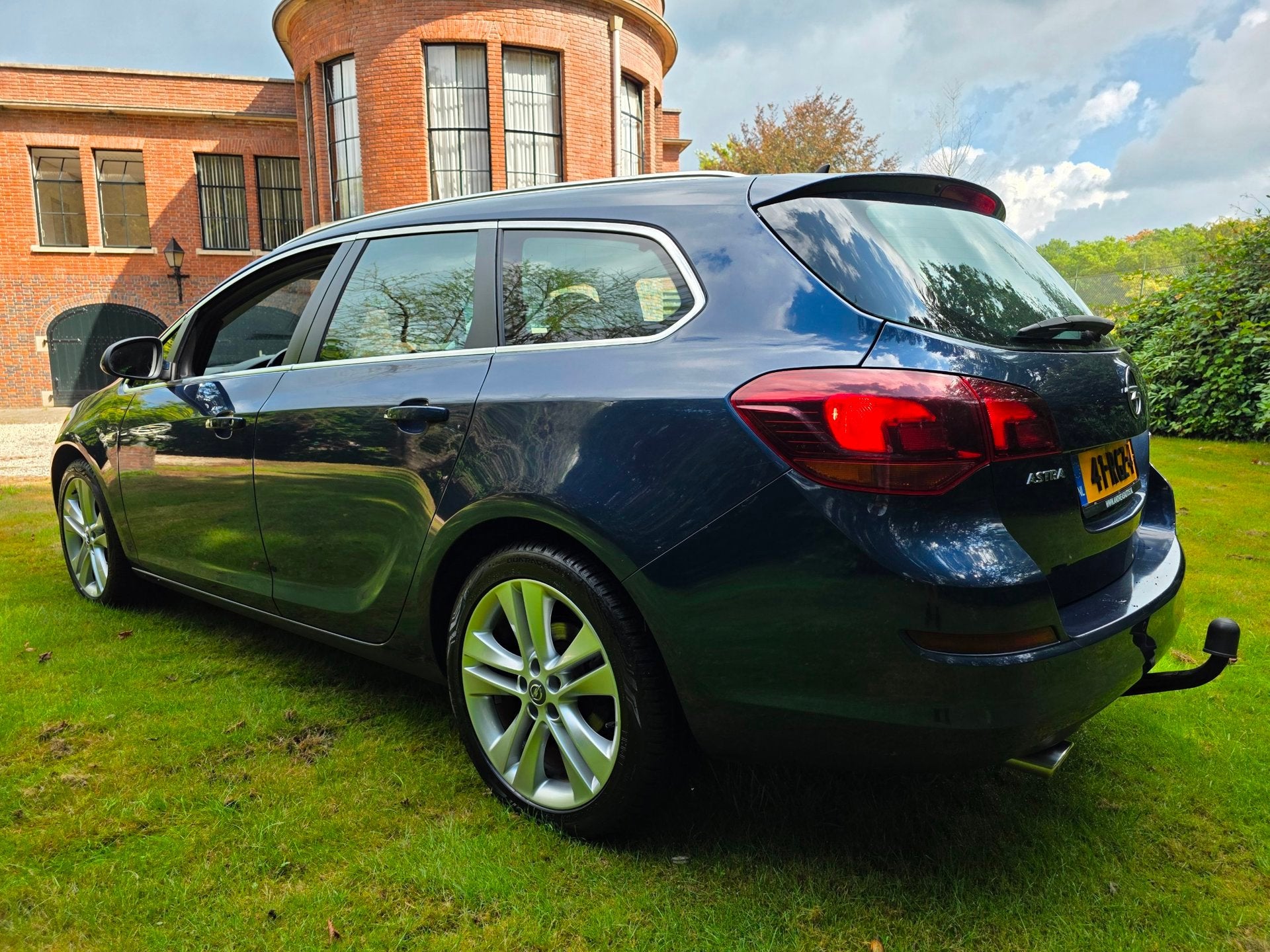 Opel Astra Sports Tourer 1.4 Turbo Sport, Auto's, Voorwielaandrijving, Euro 5, Automatische klimaatregeling, Gebruikt