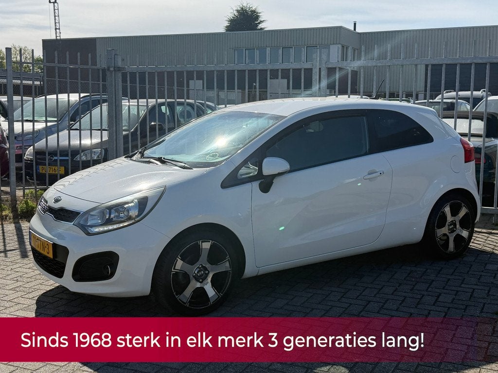 Kia Rio 1.2 CVVT Super Pack NL AUTO NAP! NAVI l Camera l Cru, Euro 5, Zwart, 4 cilinders, Wit