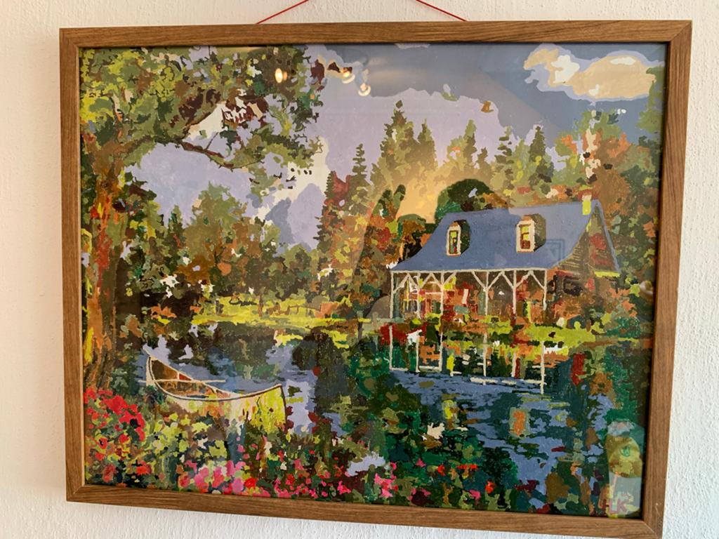 Schilderij met huisje aan het water en kano, Ophalen