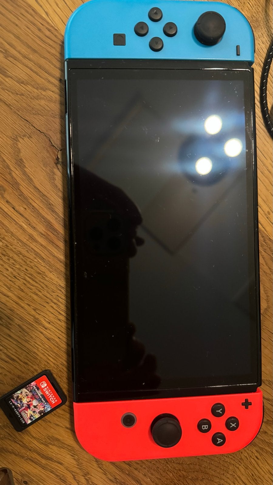 Foto 11 van Nintendo Switch Oled Model Zwart 8 maanden oud