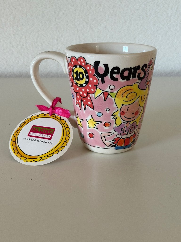 Blond Amsterdam Mok/Beker 10 years of blondness, Keramiek, Nieuw, Ophalen of Verzenden, Kop(pen) en/of Schotel(s)