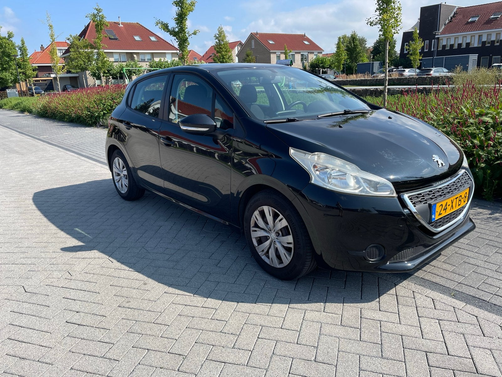 Peugeot 208 1.2 VTi 82PK 5D (102g) 2012 Zwart, Auto's, Voorwielaandrijving, Stof, Zwart, Origineel Nederlands