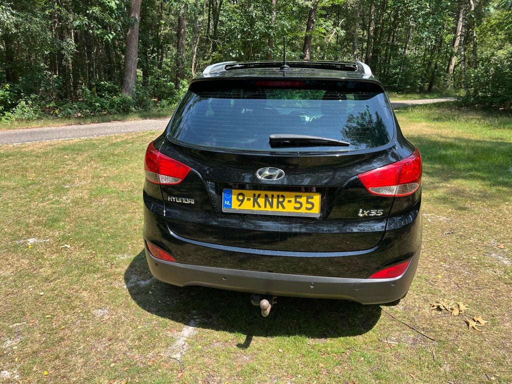 Hyundai Tucson 2.0 I 120KW 2WD 2012 Zwart, Euro 5, Zwart, 4 cilinders, Leder en Stof