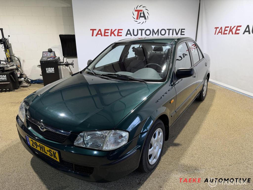Mazda 323 1.5i LX LEES TEKST, Auto's, Stof, 4 cilinders, 400 kg, Origineel Nederlands