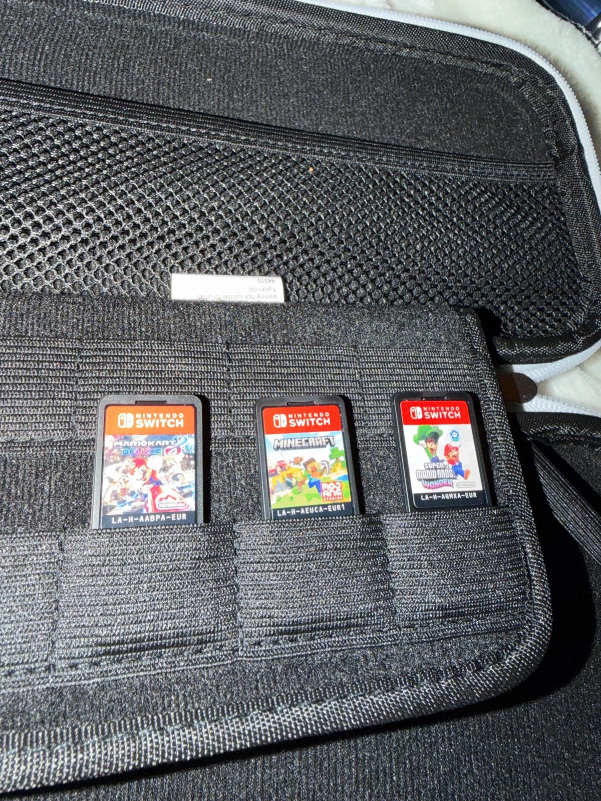 Foto 6 van Nintendo Switch OLED met 3 games en accessoires