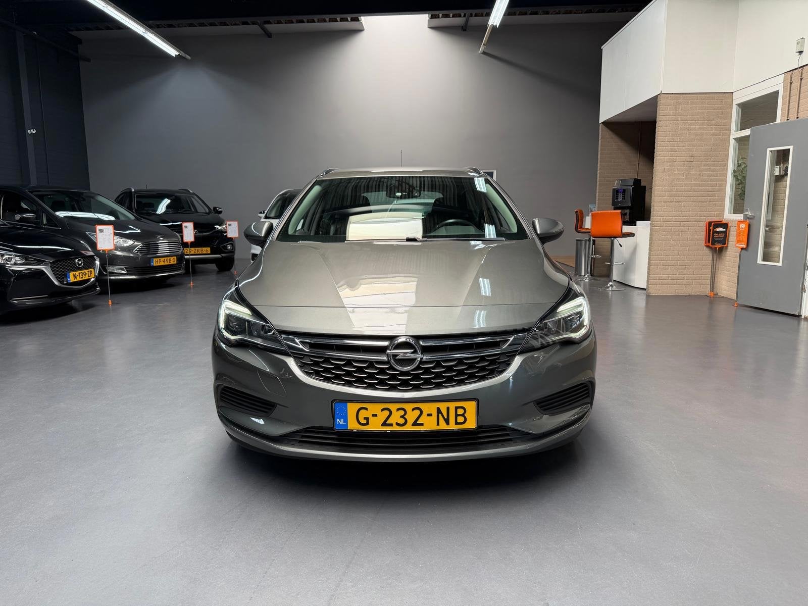 Opel Astra Sports Tourer 1.4 Turbo Business+ DEALER ONDERHOU, Auto's, Voorwielaandrijving, Gebruikt, Euro 6, 4 cilinders