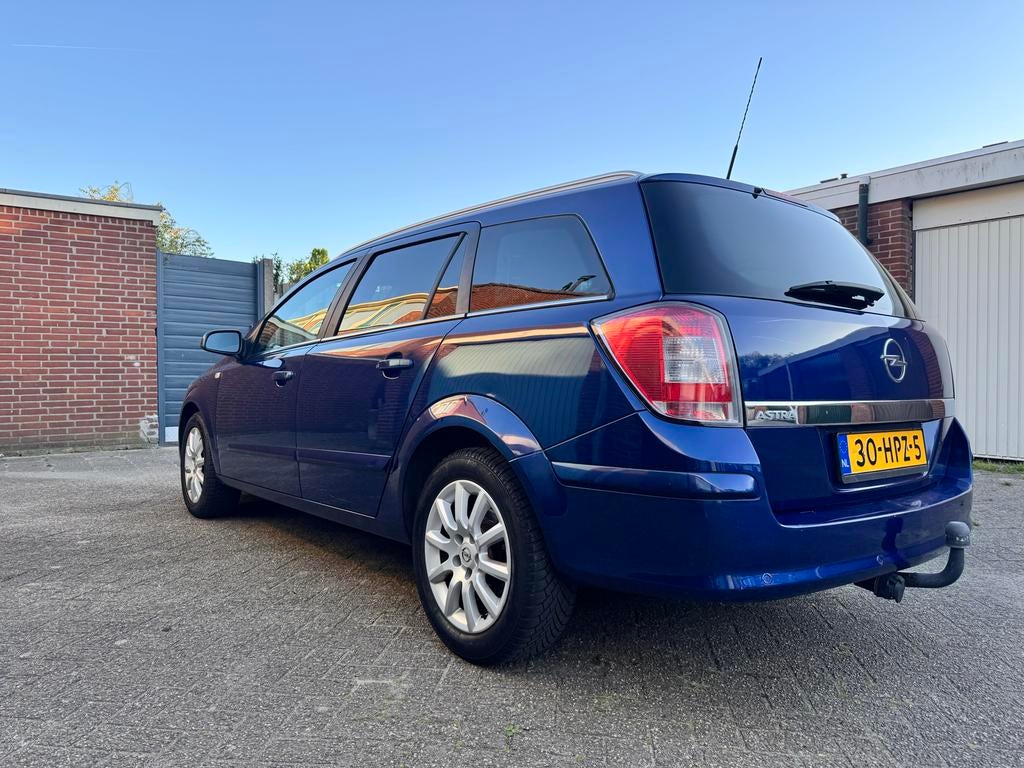 Opel Astra 1.6 16V 85KW St.wgn. 2009 Blauw, Auto's, Opel, Voorwielaandrijving, 15 km/l, Blauw, Origineel Nederlands