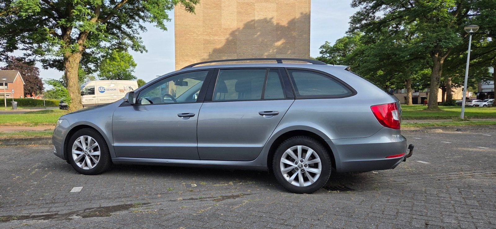 Skoda Superb 1.6TDI 77KW Greenline Combi 2012 Grijs, Auto's, Voorwielaandrijving, Stof, Zwart, 4 cilinders