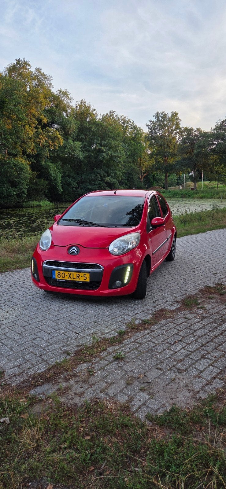 Citroën C1 1.0i 68PK 5D 2012 Rood, Voorwielaandrijving, Stof, Zwart, 4 stoelen