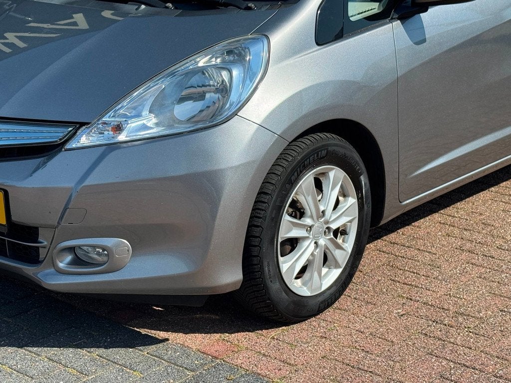 Honda Jazz 1.4 Hybrid Business Mode AUT|PANO|Cruise|DealerOH, Auto's, Honda, Euro 5, Stof, Gebruikt, 4 cilinders