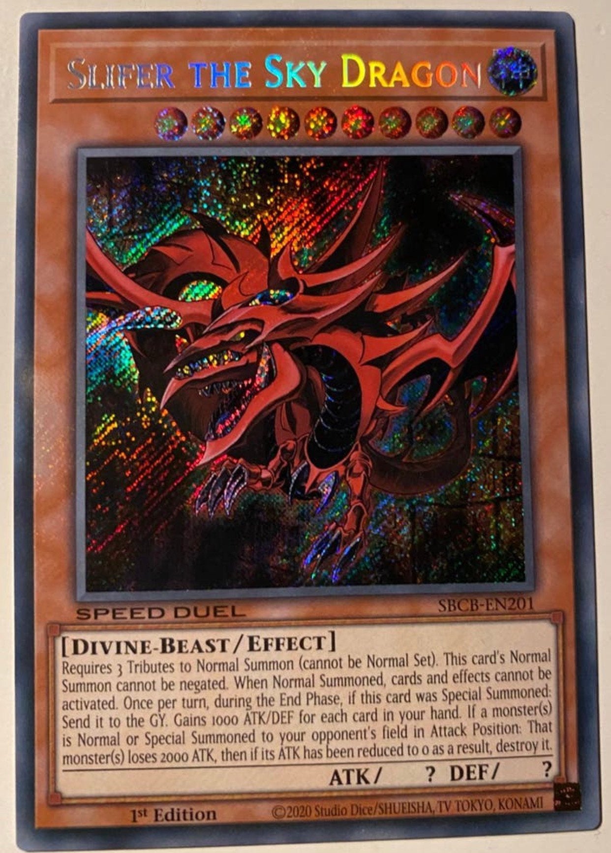 Yu-Gi-Oh! Slifer the Sky Dragon SBCB 1st Edition !, Ophalen of Verzenden, Zo goed als nieuw, Losse kaart, Foil