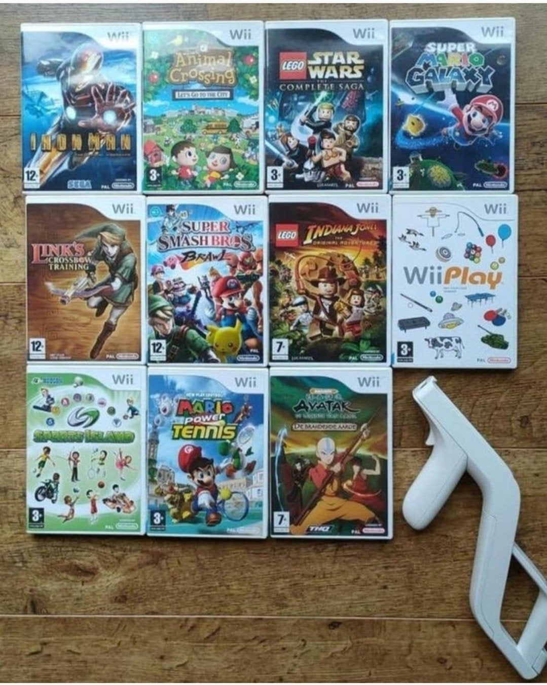 Partij Wii spellen + zapper, Spelcomputers en Games, Ophalen of Verzenden, Zo goed als nieuw, Met 1 controller