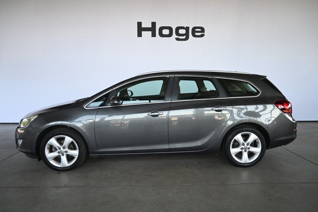 Opel Astra Sports Tourer 1.4 Cosmo Airco Cruise Control Trek, Voorwielaandrijving, Euro 5, Gebruikt, 4 cilinders