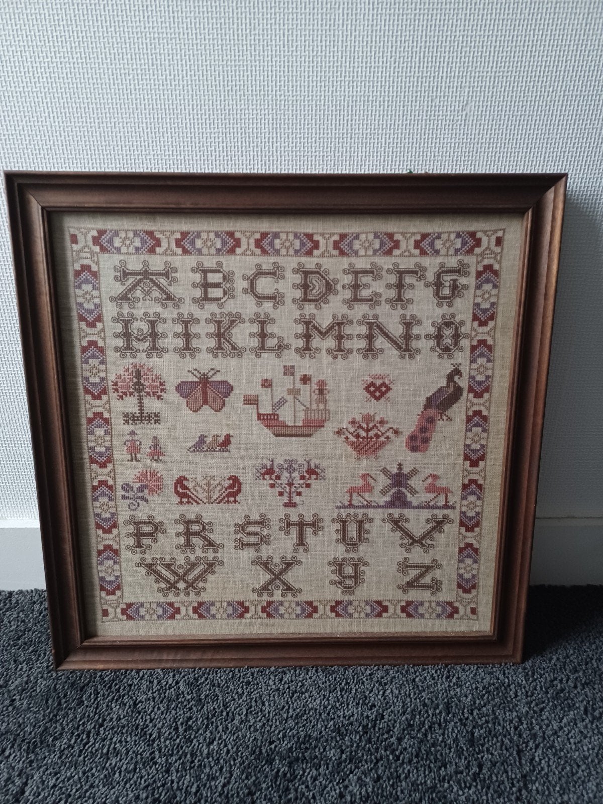 Oude merklap, handgeborduurd,  ABC, Ophalen