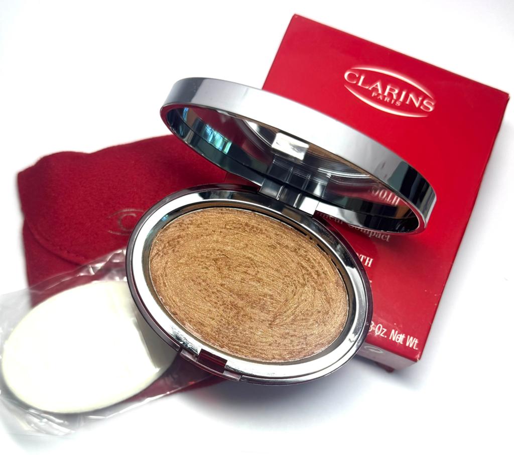 Clarins instant smooth conpact highlighter 02 bronze, Ophalen of Verzenden, Zo goed als nieuw, Bruin, Gehele gezicht