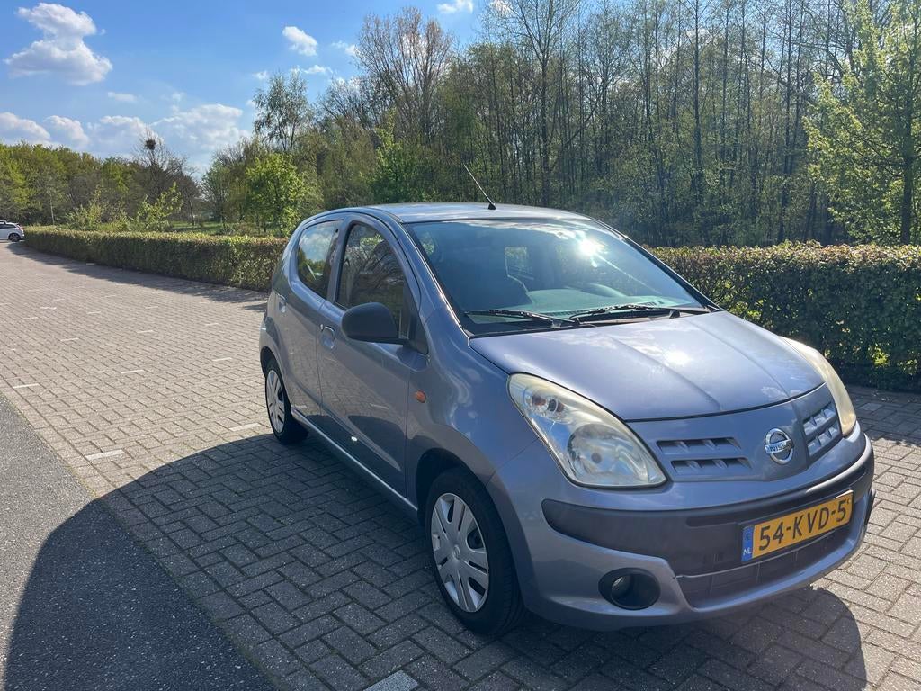 Nissan Pixo 1.0 50KW 5D 2010 Grijs, Auto's, Nissan, Voorwielaandrijving, Stof, Origineel Nederlands, Handgeschakeld