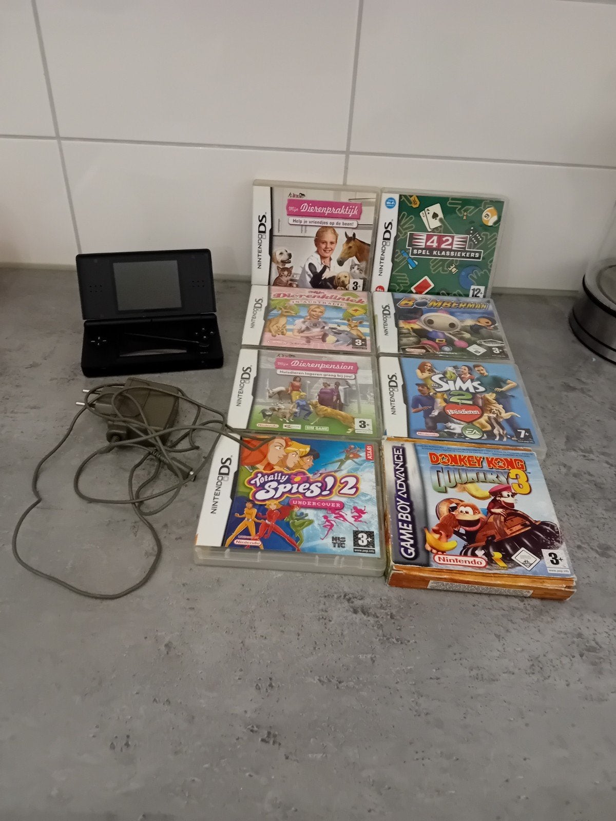 Nintendo DS Lite Zwart met 8 games en oplader, Ophalen, Zwart, DS Lite, Gebruikt