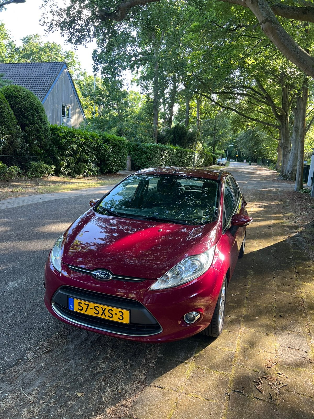 Ford Fiësta 1.25 60KW 5DR 2012 Rood, Auto's, Voorwielaandrijving, Euro 5, Stof, 1242 cc