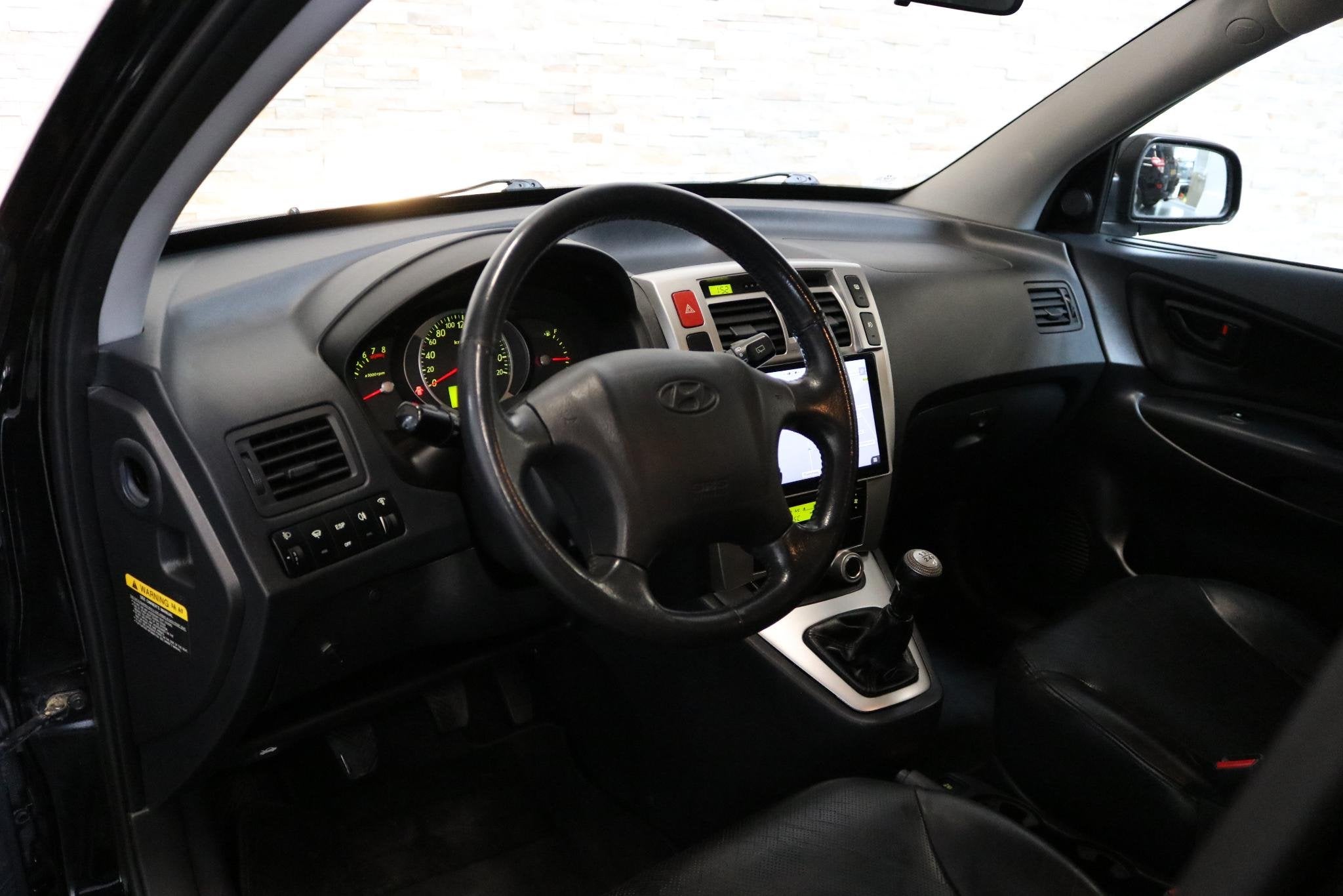 Hyundai Tucson 2.0i Style Supreme, Auto's, Hyundai, Gebruikt, 4 cilinders, Zwart, Handgeschakeld