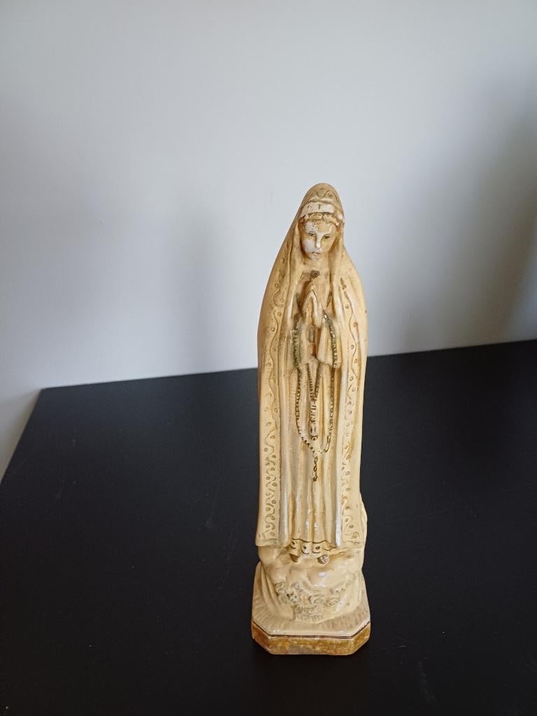 Marie wit beeld, Ophalen
