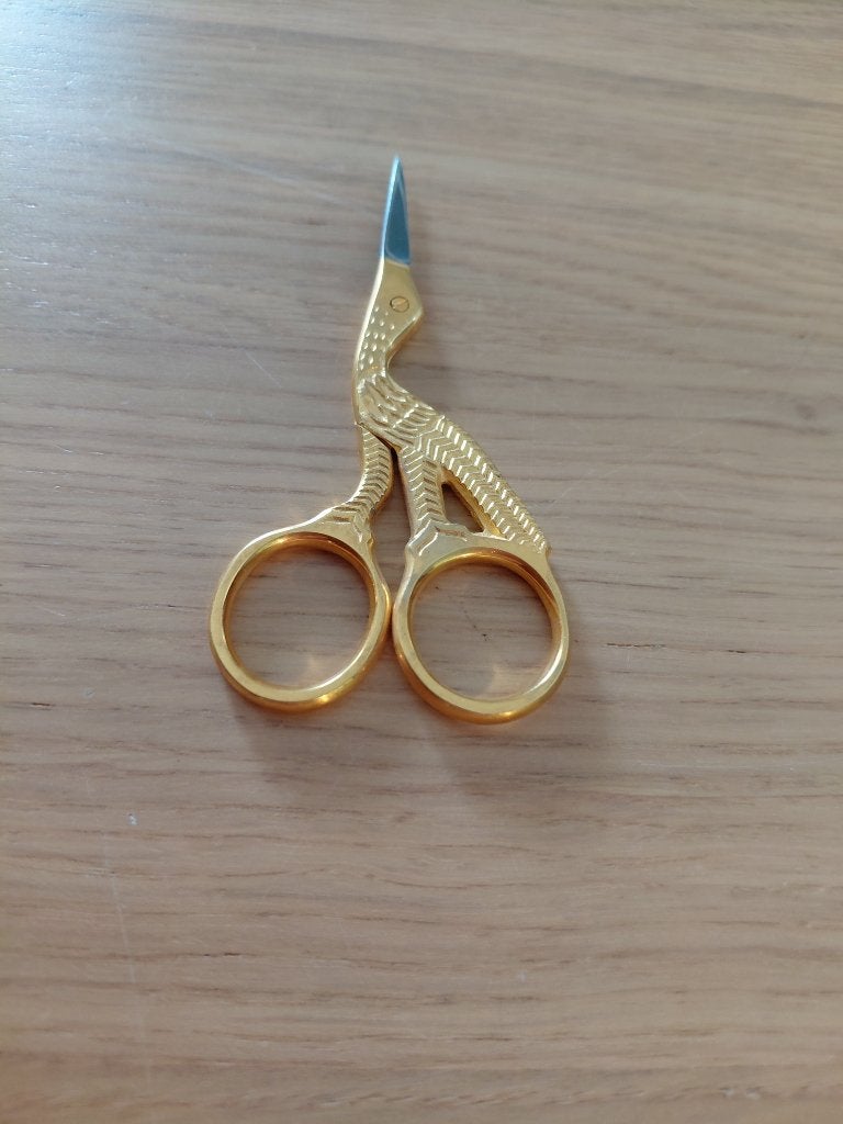 schaartje ooievaar goudkleurig, Ophalen of Verzenden