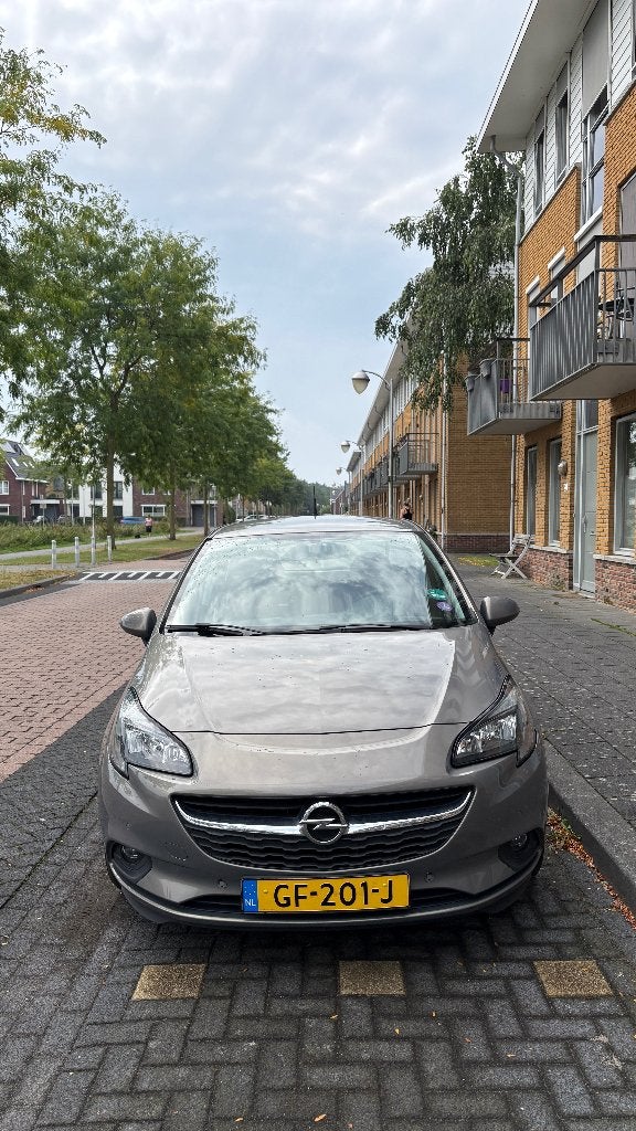 Opel Corsa 1.0 Turbo 2015 — 63.000 km, trekhaak, APK 06-2027, Voorwielaandrijving, Bruin, Leder en Stof, Origineel Nederlands