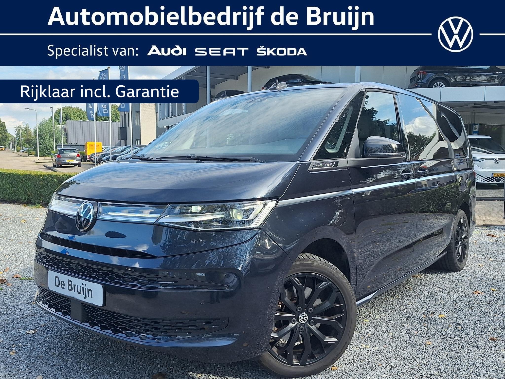 Volkswagen Multivan 1.5 Hybrid L2 Style 4m 7p (Pano,Trekhaak, Auto's, 12 maanden, Euro 6, 7 stoelen, Overige kleuren