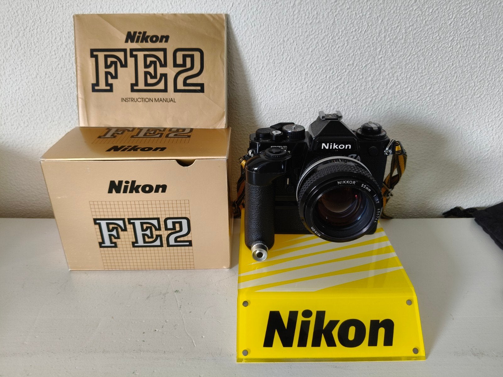 Nikon FE2 Spiegelreflexcamera met Nikkor 55mm 1:1.2 lens, Audio, Tv en Foto, Fotocamera's Analoog, Ophalen of Verzenden, Zo goed als nieuw