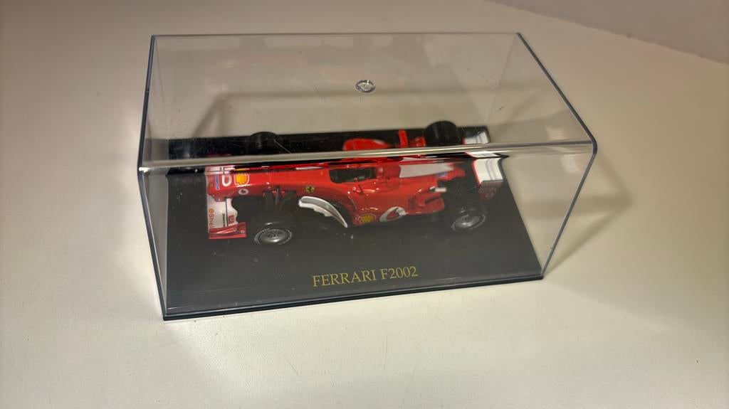 Ferrari f2002 atlas 1.43, Hobby en Vrije tijd, Modelauto's | 1:43, Overige merken, Auto, Ophalen of Verzenden, A