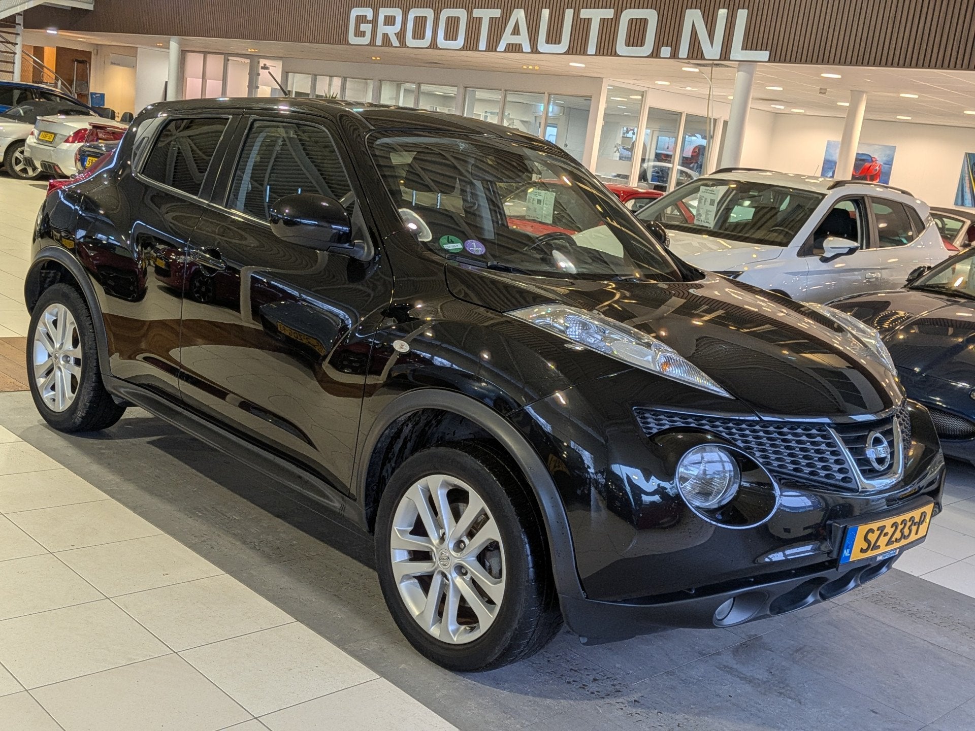 Nissan Juke 1.6 DIG-T Tekna Airco, Cruise Control, Trekhaak,, Auto's, Voorwielaandrijving, Gebruikt, Zwart, 14 km/l