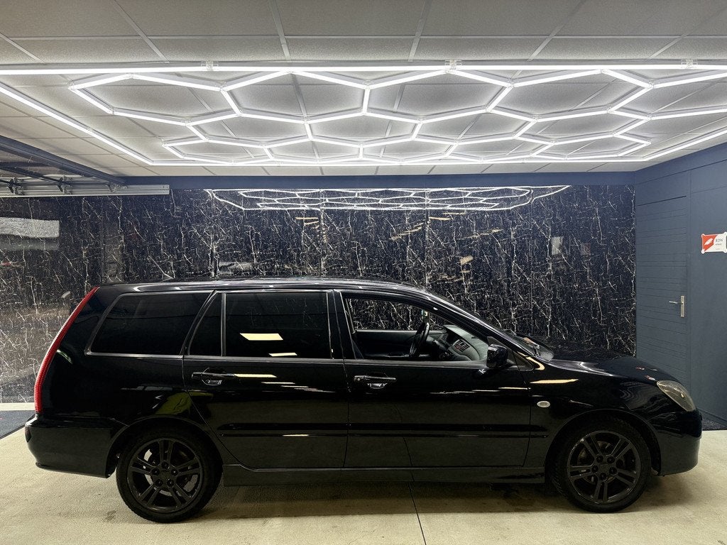 Mitsubishi Lancer Station Wagon 1.6 Sport (bj 2004), Auto's, Voorwielaandrijving, Gebruikt, 4 cilinders, 400 kg