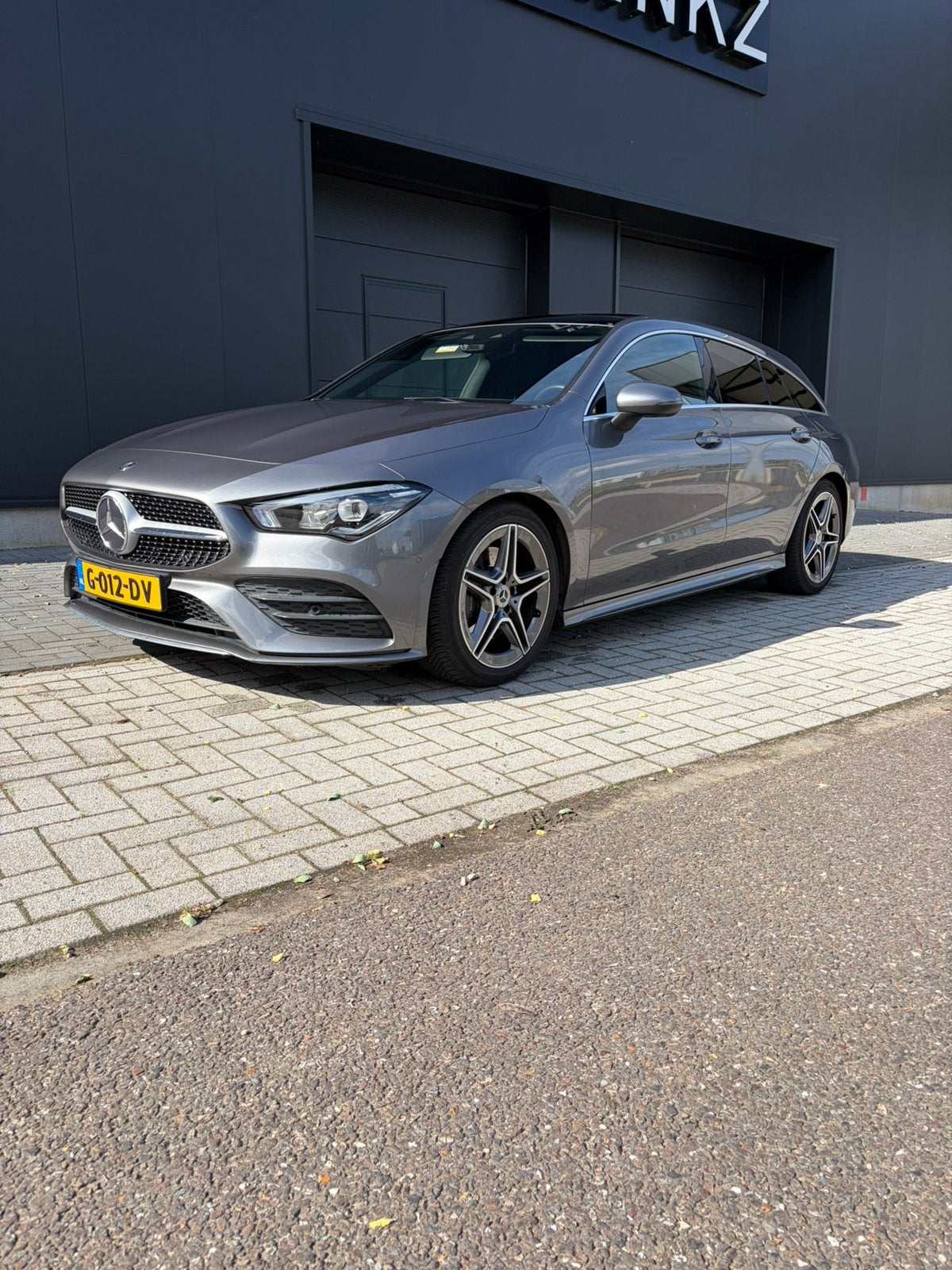 Mercedes-Benz CLA 200 shooting Brake AMG Line, Zwart, 4 cilinders, Leder en Stof, 163 pk