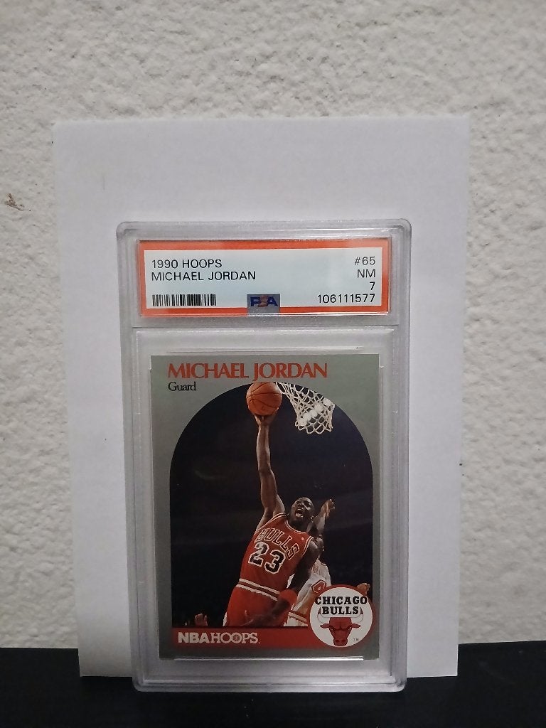 Michael Jordan 1990 psa 7, Hobby en Vrije tijd, Verzamelkaartspellen | Overige, Ophalen of Verzenden, Nieuw, Losse kaart