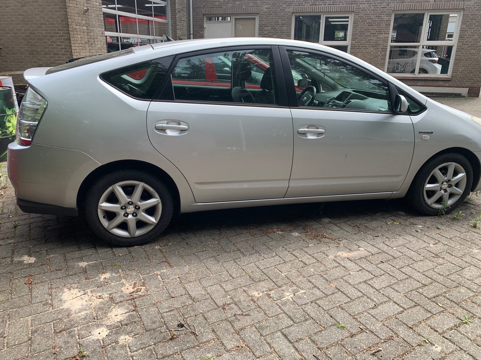 Toyota Prius 1.5 HSD 2006 Grijs, Auto's, 1497 cc, 4 cilinders, 23 km/l, Origineel Nederlands