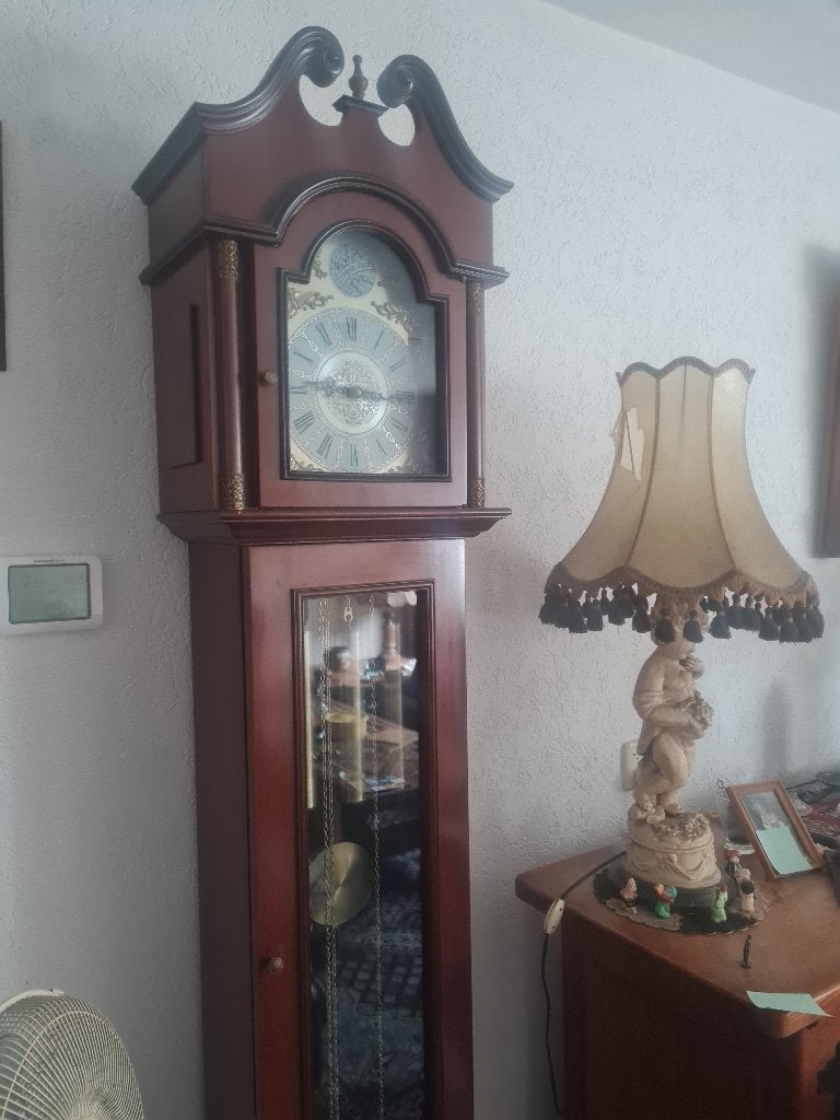 Wand klok staand, Ophalen