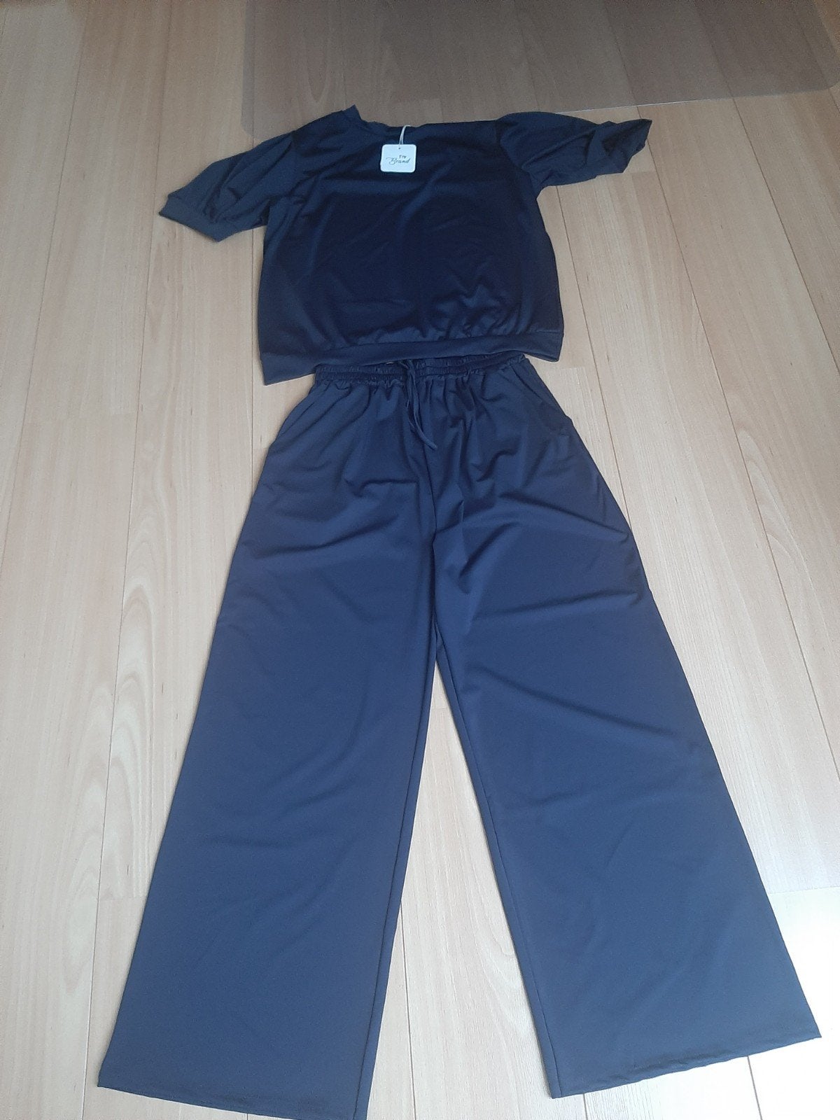 Nieuw donkerblauw maat 44 broekpak met wijde pijp en pofmouw, Ophalen of Verzenden, Nieuw, Maat 46/48 (XL) of groter, Blauw