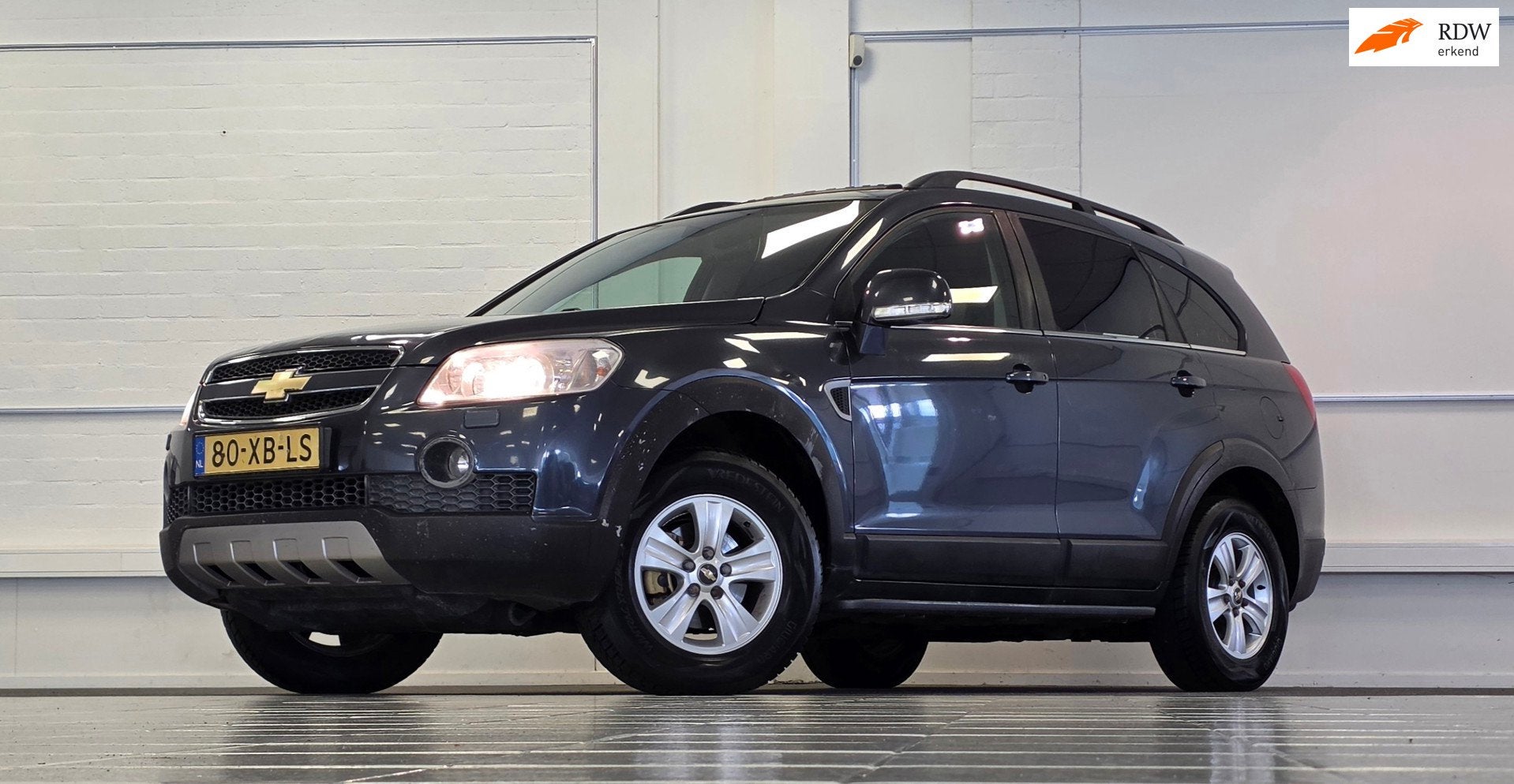 Chevrolet Captiva 2.4i Executive 7p Leder Trekhaak APK 18-07, Auto's, Chevrolet, 136 pk, Gebruikt, Zwart, 7 stoelen