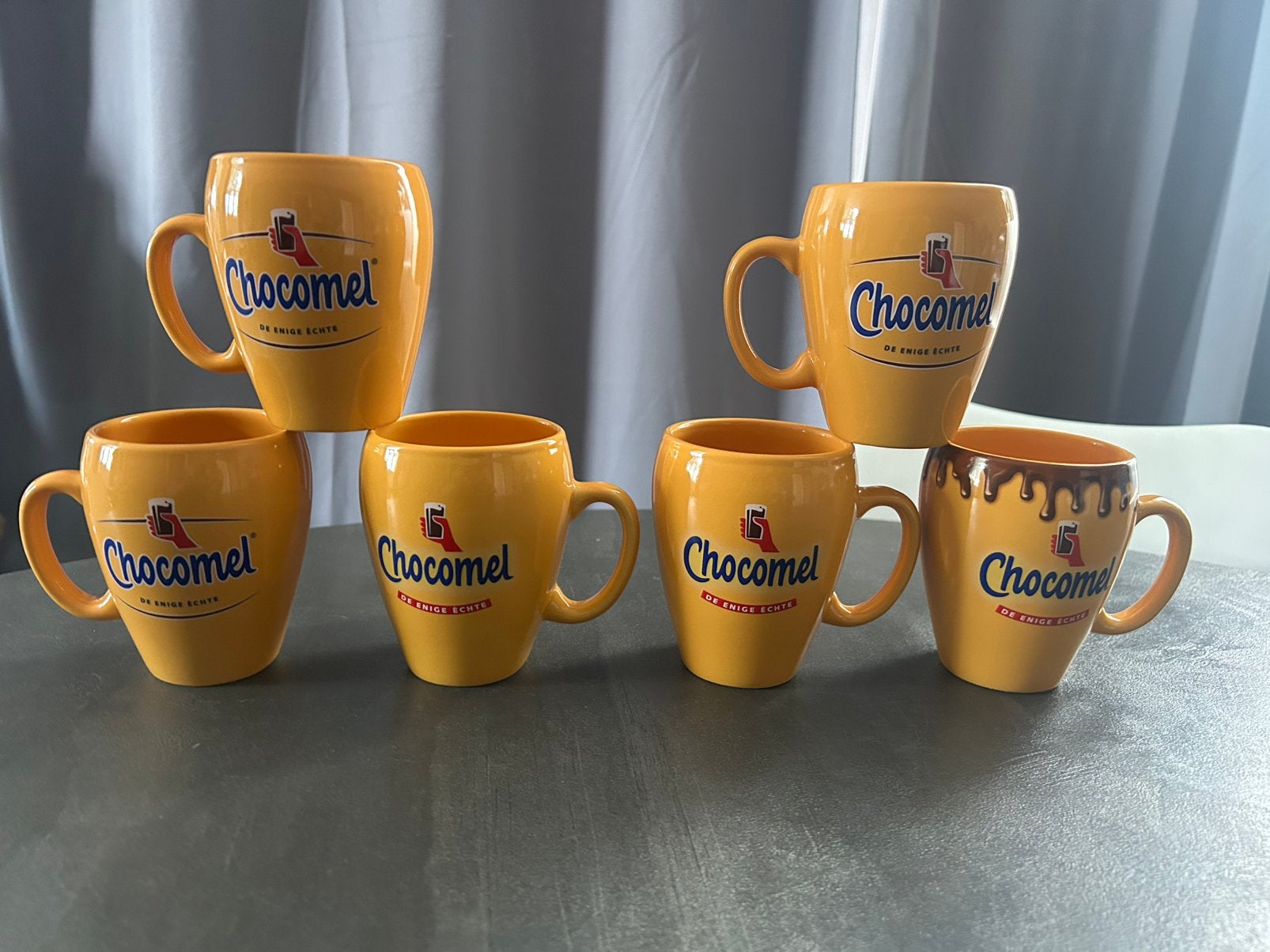 6 Chocomel bekers in uitstekende staat!, Ophalen of Verzenden, Zo goed als nieuw, Overige stijlen, Kop(pen) en/of Schotel(s)