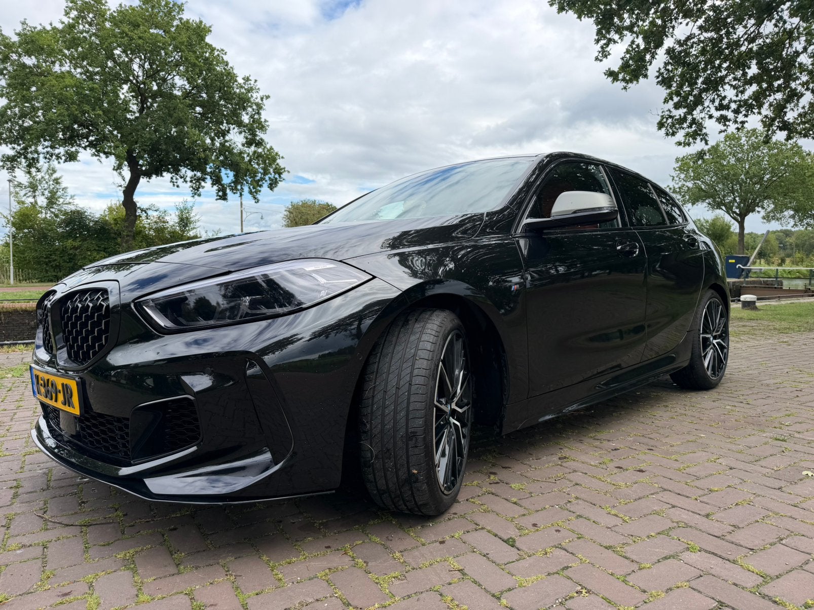 BMW M135i xDrive | 2021 | HUD | NAP | Dealeronderh. | VOL, Auto's, 1998 cc, Euro 6, 4 cilinders, Zwart