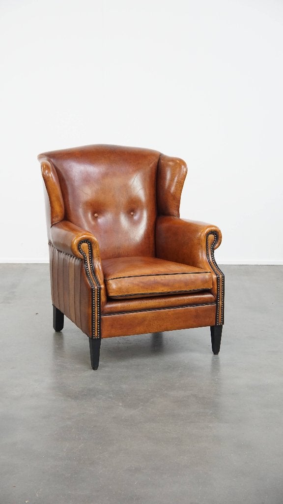 Comfortabele schapenleren oorfauteuil met zwarte biezen, Ophalen