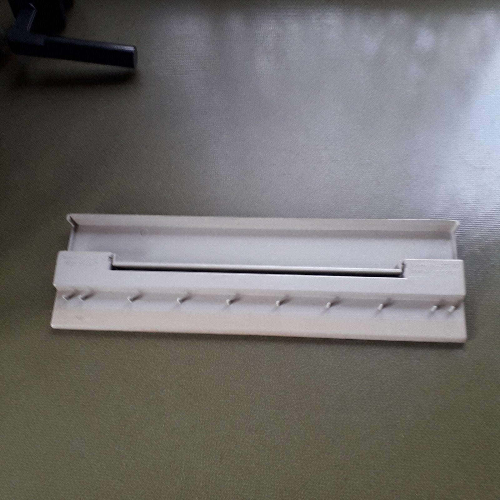 Hulpstuk voor antieke kettingprinter jaren tachtig, Ophalen