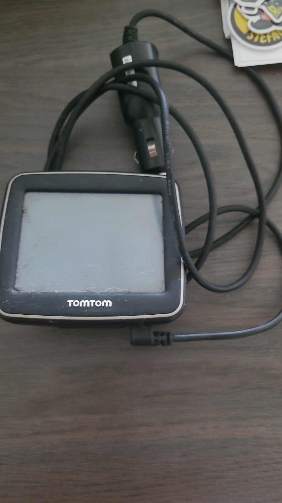 TomTom navigatiesysteem met autolader en zuignap, Ophalen