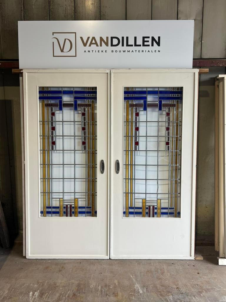 Antieke grote ensuite deuren glas in lood gekleurd