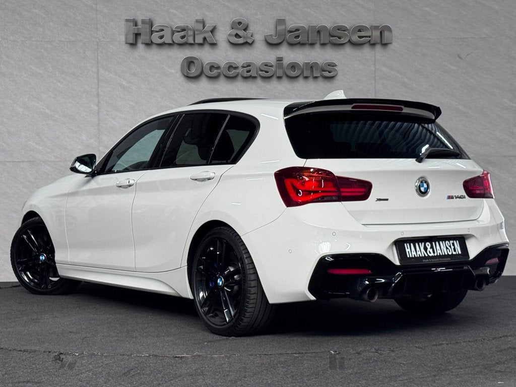 BMW 1-serie M140i xDrive High Executive HK Pano Memory Camer, Gebruikt, Zwart, Automatische klimaatregeling, Bedrijf