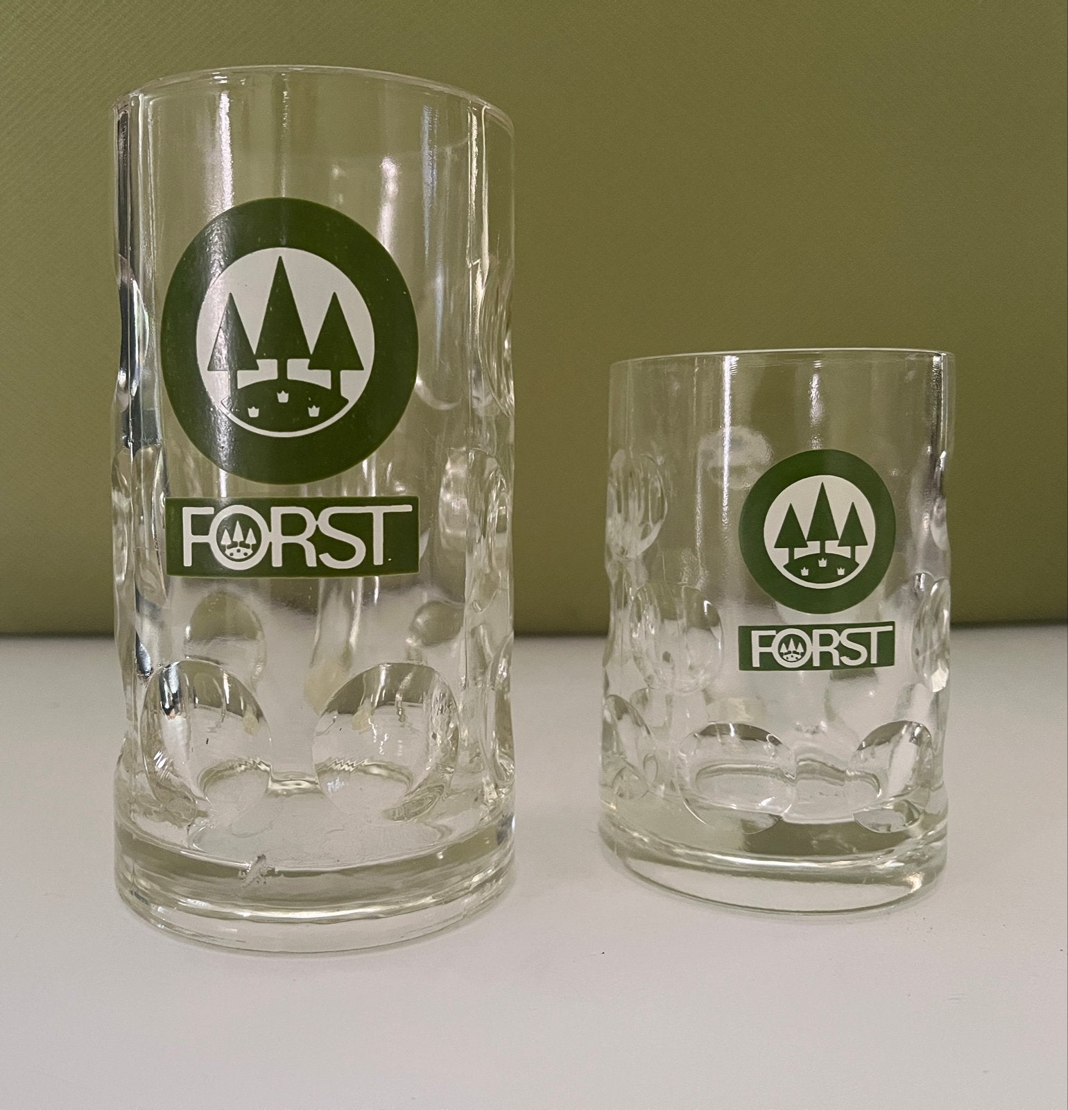 Set van 2 Forst bierpullen - Nieuwstaat, Ophalen of Verzenden, Zo goed als nieuw, Pul(len), Overige merken