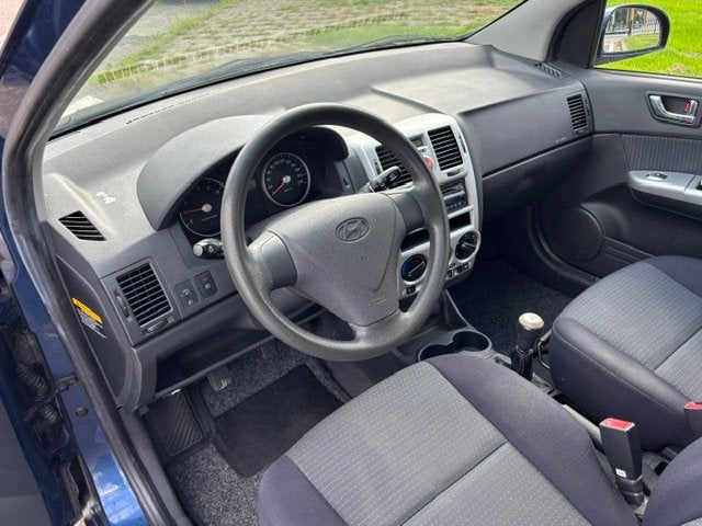 Hyundai Getz 1.4i Active Joy 5-Drs Airco Electric pakket Aud, Auto's, Voorwielaandrijving, Dealer onderhouden, 4 cilinders, Blauw