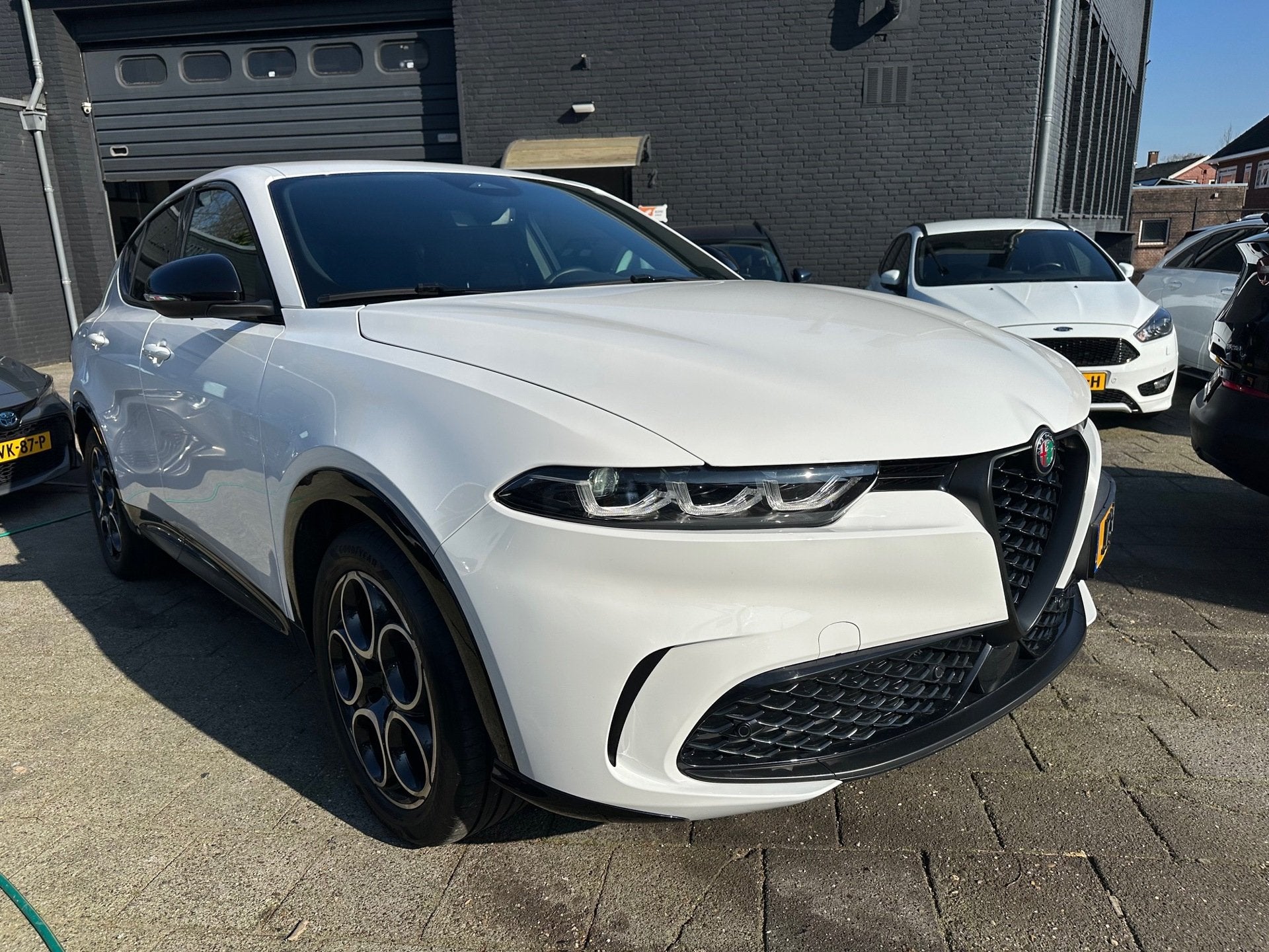 Alfa Romeo Tonale 160pk Hybrid Aut|16.000km|Leder|Fabrieksga, Auto's, Dealer onderhouden, Gebruikt, Zwart, 4 cilinders